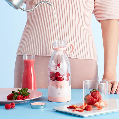 Portable blender bottle blending fresh fruit